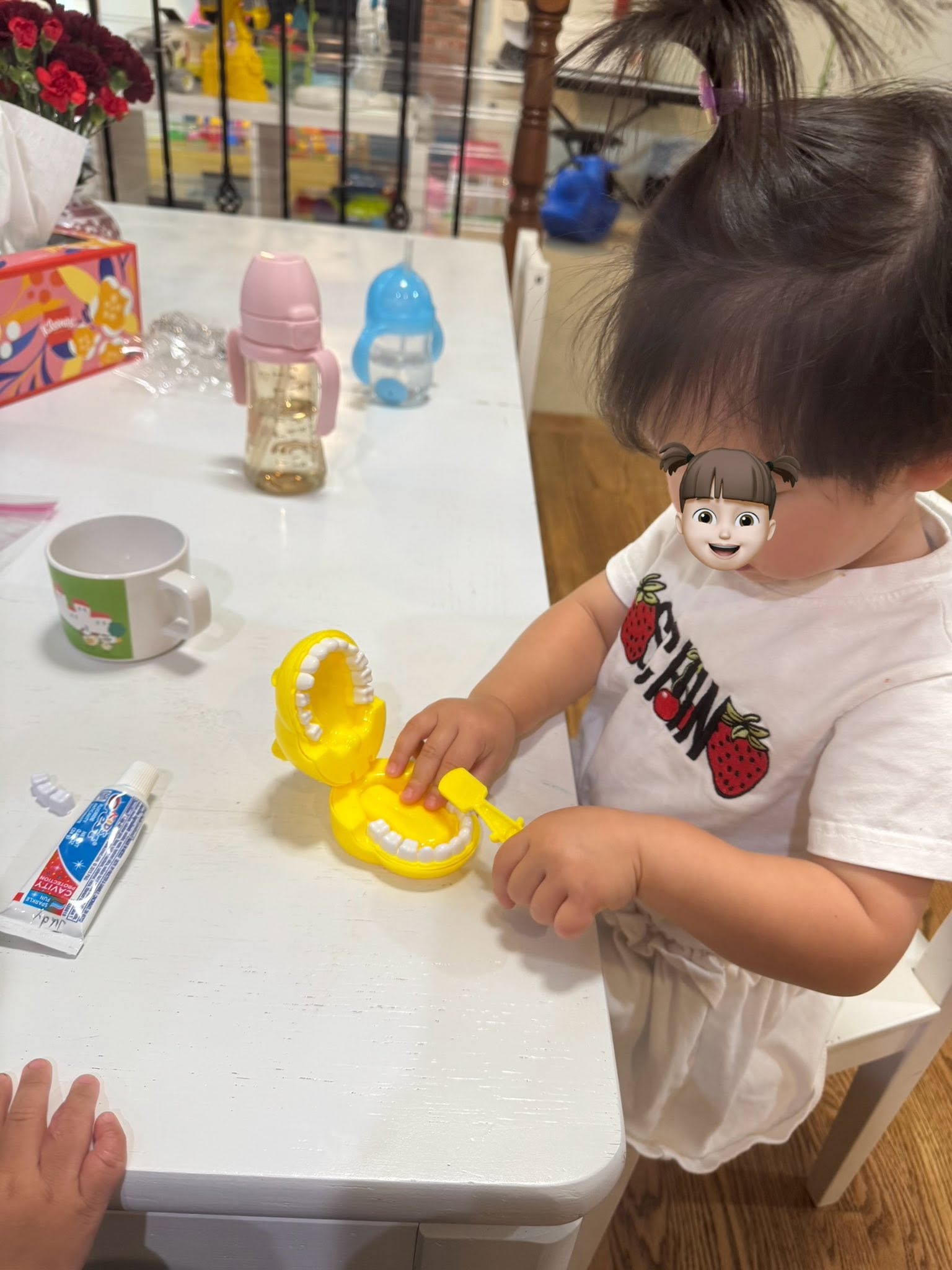 Panda Bear Childcare — child playing with dinosaur toy