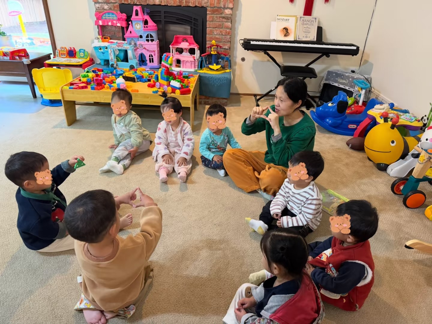 Panda Bear Childcare — teacher leading music class with toddlers