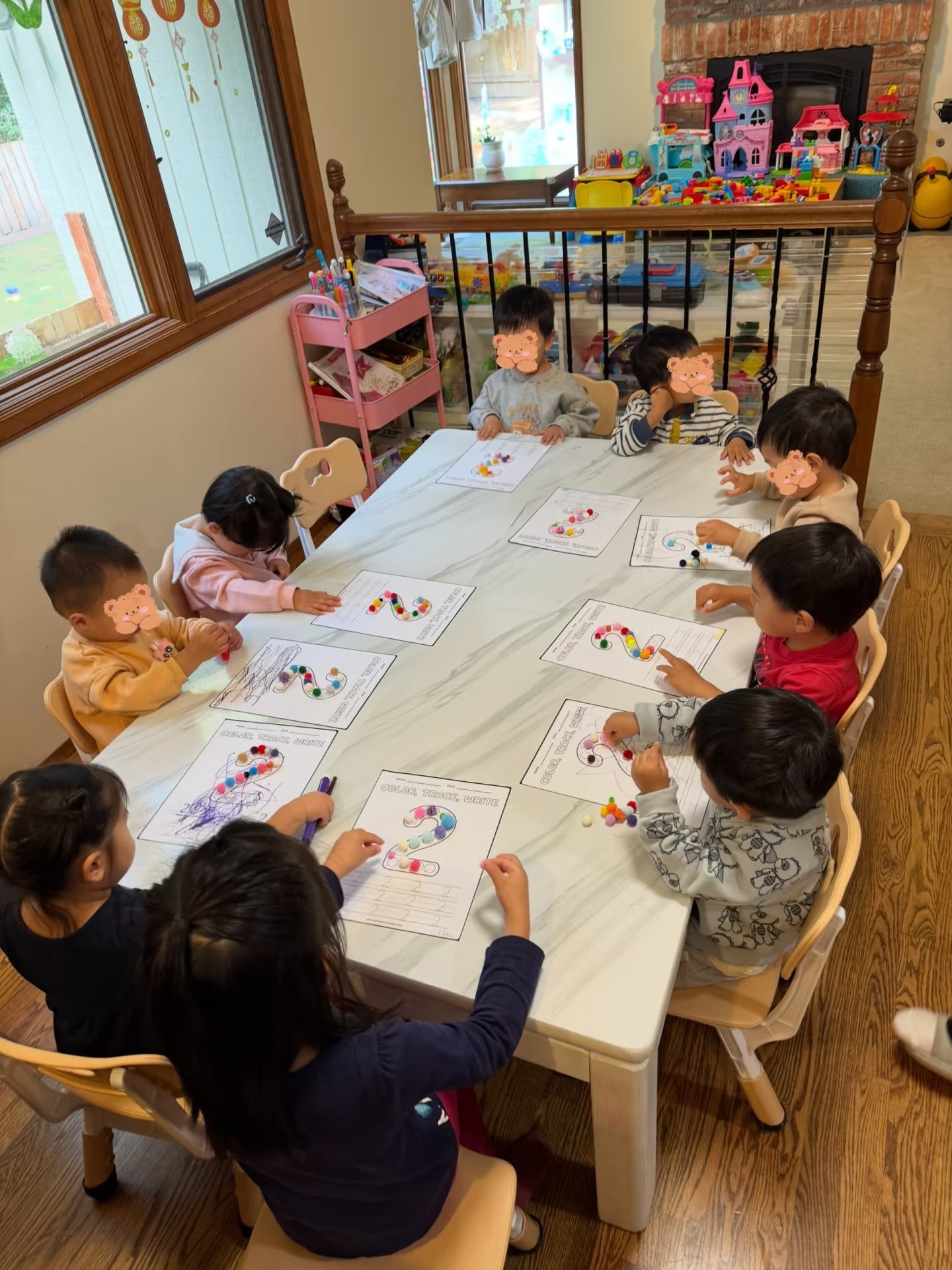Panda Bear Childcare — young children doing art activity together